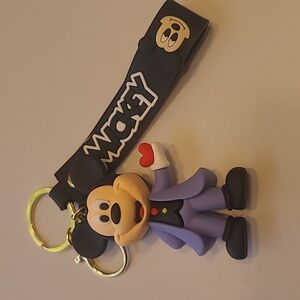 NWOT Mickey Mouse Keychain with Red and Purple Accents on a black wrist Strap.